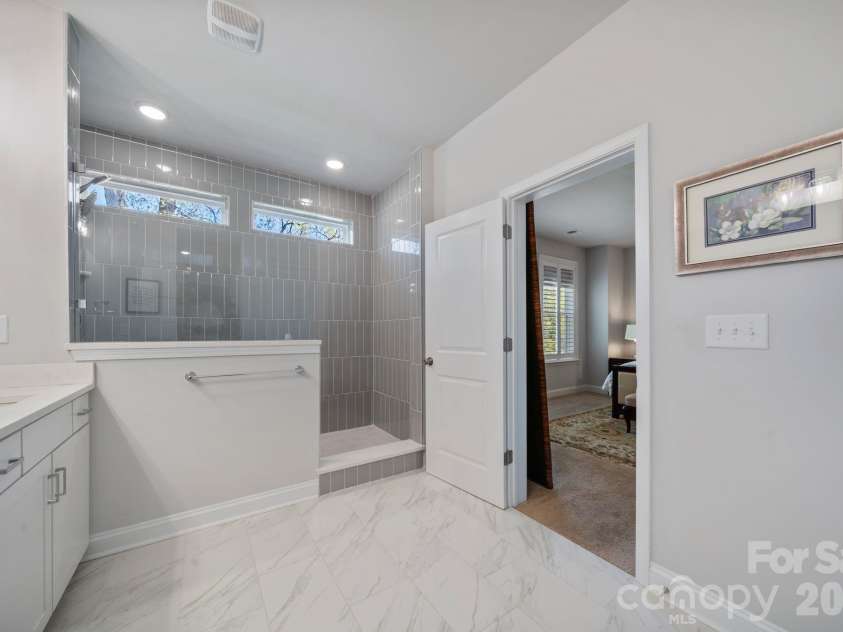 9043 Charles Francis Lane, Cornelius, NC 28031.  MLS# CAR4360316, YatesRealty ID 17944. Primary bathroom with walk-in shower