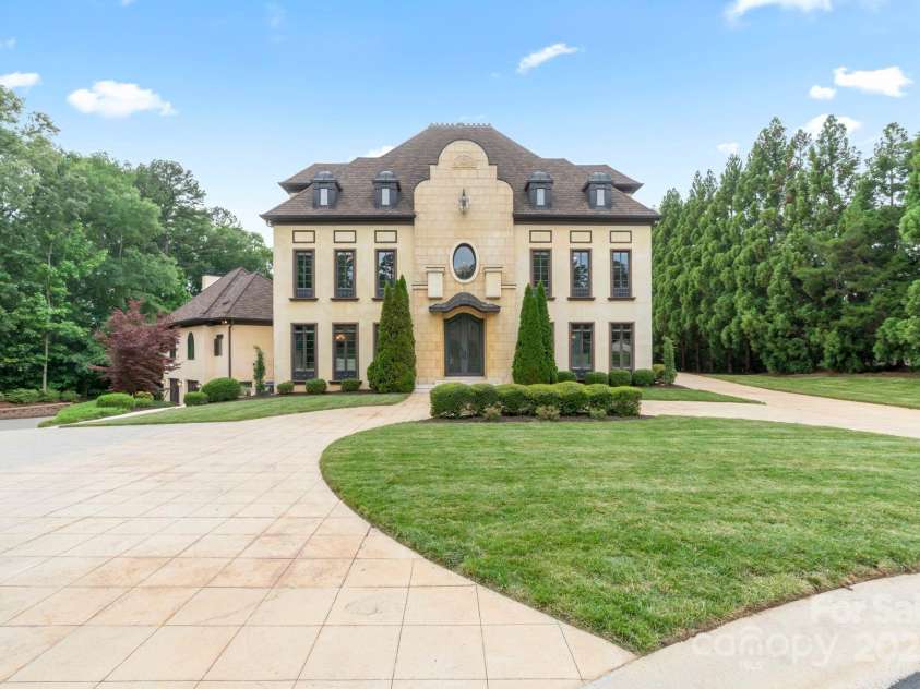 1118 Seminole Drive, Fort Mill, SC 29707.  MLS# CAR4256209, YatesRealty ID 17950. Circular driveway to your estate with garages to the right and left of the property