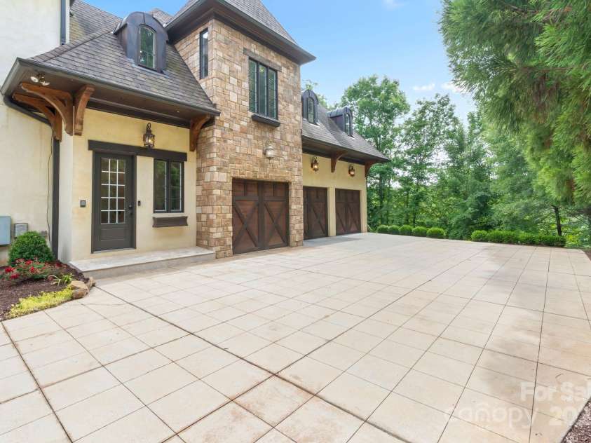 1118 Seminole Drive, Fort Mill, SC 29707.  MLS# CAR4256209, YatesRealty ID 17950. Separate entrance to the right of the home and 3 car garage that leads you into the drop-zone and kitchen.