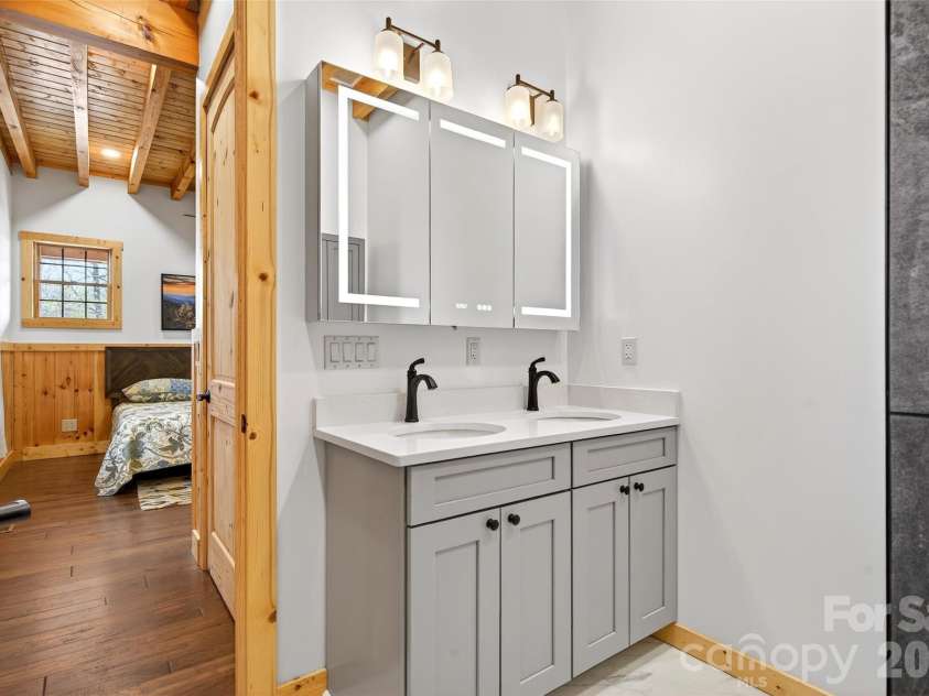 501 Wolf Pen Cliffs Road, Old Fort, NC 28762.  MLS# CAR4365894, YatesRealty ID 17951. Illuminated smart mirror cabinet.