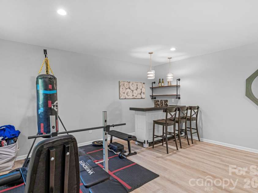 5000 Lily Pond Circle, Waxhaw, NC 28173.  MLS# CAR4369036, YatesRealty ID 17954. Finished basement with bar area
