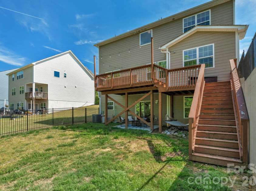 5000 Lily Pond Circle, Waxhaw, NC 28173.  MLS# CAR4369036, YatesRealty ID 17954. View of home from backyard