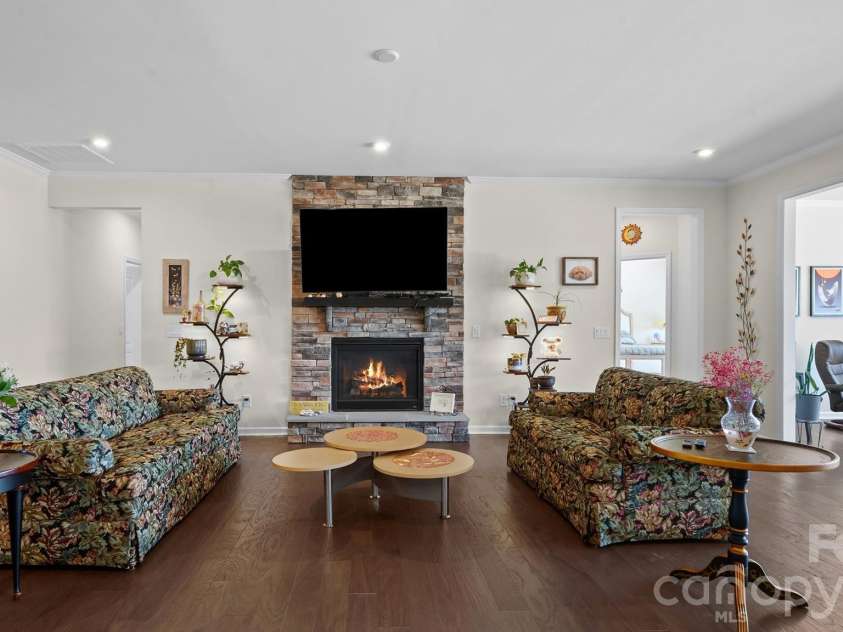 2017 Grove Place, Fort Mill, SC 29715.  MLS# CAR4372923, YatesRealty ID 17957. Great Room w/stone fireplace w/raised hearth.