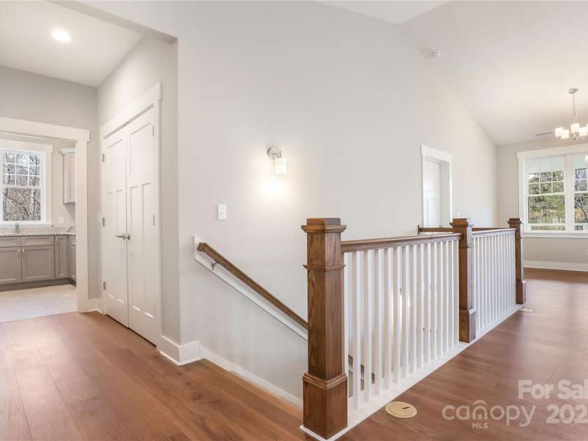 77 Creekside View Drive, Asheville, NC 28804.  MLS# CAR4109113, YatesRealty ID 17957. Laundry room on main and wide staircase leading to the lower finished level