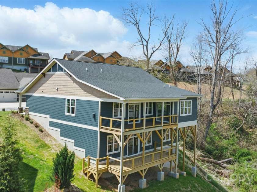 77 Creekside View Drive, Asheville, NC 28804.  MLS# CAR4109113, YatesRealty ID 17957. Rear, exterior view of home. Double decks!