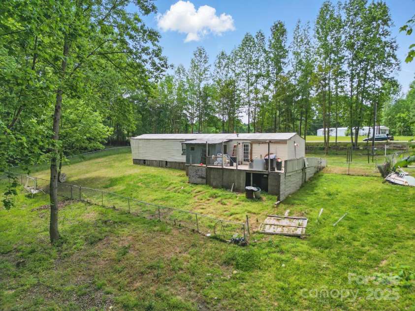 10420 Silver Mine Road, Indian Land, SC 29707.  MLS# CAR4251908, YatesRealty ID 1796. Rear view of subject and back yard