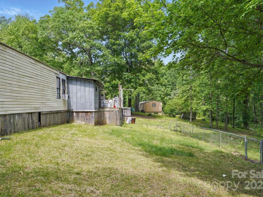 10420 Silver Mine Road, Indian Land, SC 29707.  MLS# CAR4251908, YatesRealty ID 1796. Rear view of subject condition reference
