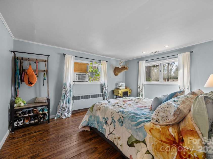 215 Cedar Lane, Arden, NC 28704.  MLS# CAR4224990, YatesRealty ID 1796. Front bedroom with original hardwood floors.