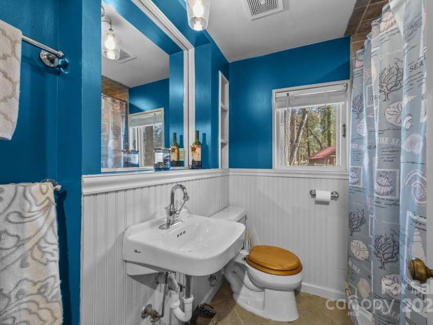 215 Cedar Lane, Arden, NC 28704.  MLS# CAR4224990, YatesRealty ID 1796. Hall bathroom with shower.