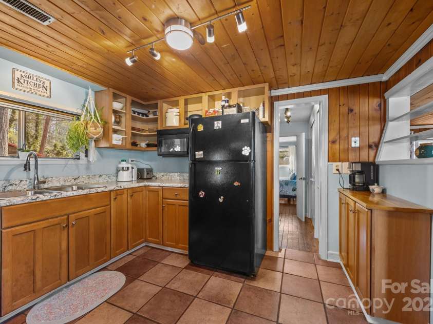 215 Cedar Lane, Arden, NC 28704.  MLS# CAR4224990, YatesRealty ID 1796. Looking down hallway towards front bedroom.