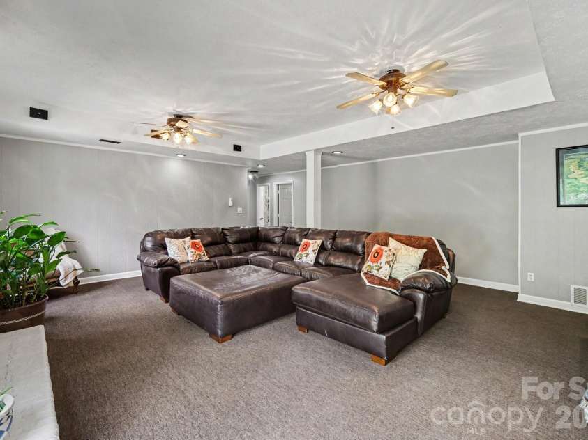 7108 Hollyhouse Drive, Charlotte, NC 28215.  MLS# CAR4366405, YatesRealty ID 17962. BASEMENT FAMILY ROOM