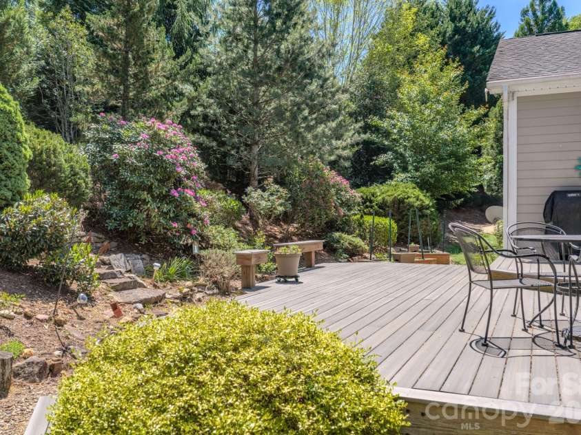 7 Magic Sam Court, Biltmore Lake, NC 28715.  MLS# CAR4374946, YatesRealty ID 17964. Beautiful backyard oasis with Trex decking and natural privacy