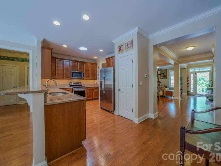 7 Magic Sam Court, Biltmore Lake, NC 28715.  MLS# CAR4374946, YatesRealty ID 17964. Kitchen has large eat in breakfast bar plus pantry, ideal for entertaining