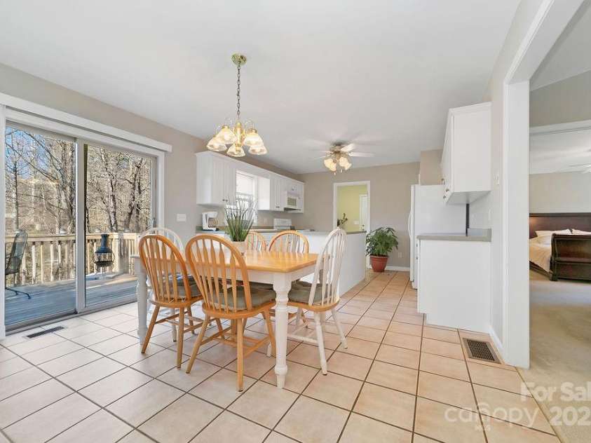 43 Redden Road, Hendersonville, NC 28739.  MLS# CAR4330221, YatesRealty ID 1797. Dining Area to Rear Deck