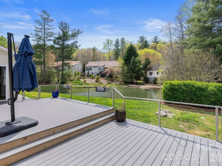 79 Mill Pond Way, Hendersonville, NC 28791.  MLS# CAR4363117, YatesRealty ID 17971. Large Spacious rear deck with soothing views and Fire-Pit