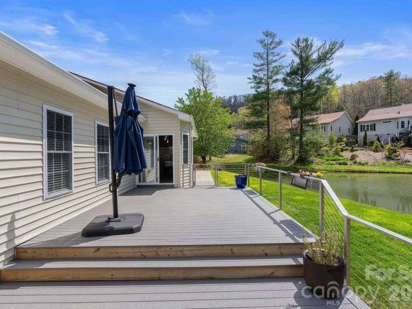 79 Mill Pond Way, Hendersonville, NC 28791.  MLS# CAR4363117, YatesRealty ID 17971. Rear main level entry and new decking