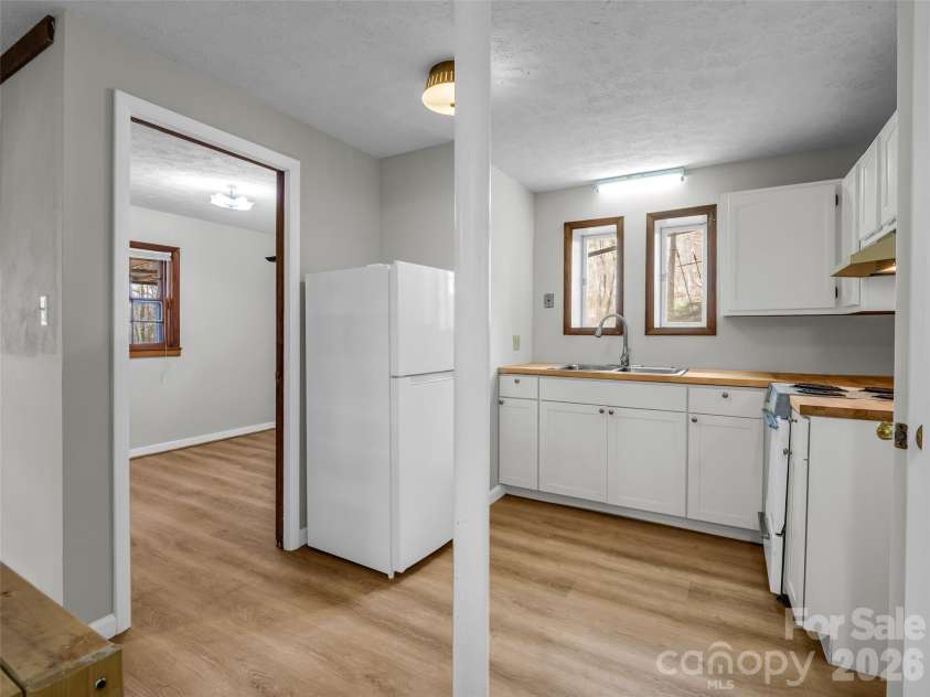 1 Alpine Way, Swannanoa, NC 28778.  MLS# CAR4362025, YatesRealty ID 17982. Basement kitchen