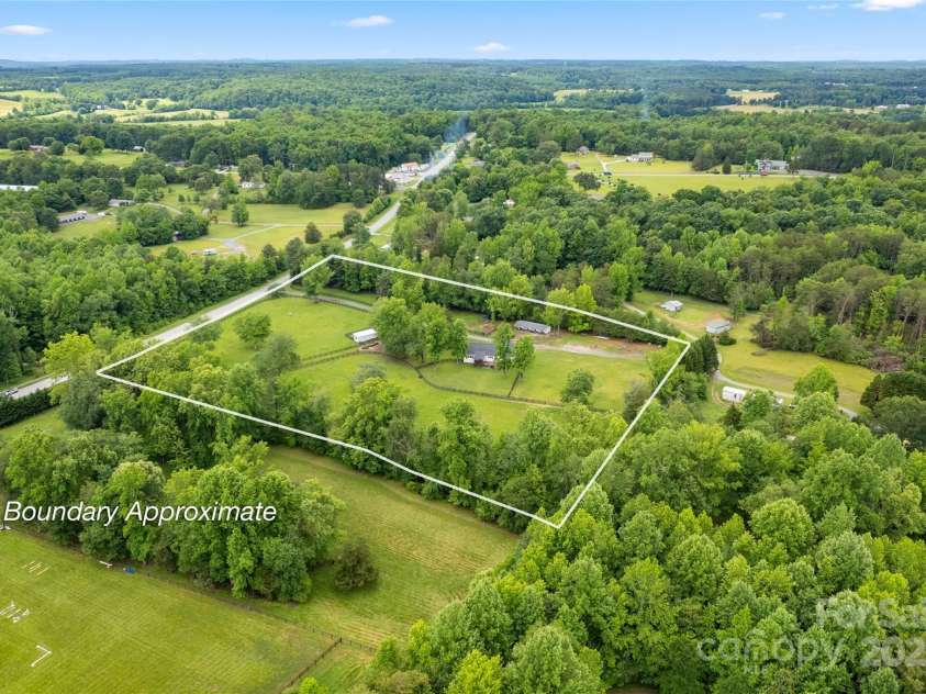 94 Jamestown Lane, Columbus, NC 28722.  MLS# CAR4262620, YatesRealty ID 17982. Absolutely TURNKEY horse farm fully fenced, flat pastures, and 5 big stalls ready for your horses!