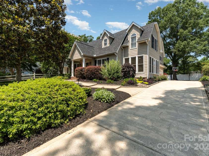 141 Eastover Drive, Concord, NC 28025.  MLS# CAR4264059, YatesRealty ID 17985. Gorgeous streetscape.  Home is much larger than the view from the front appears.