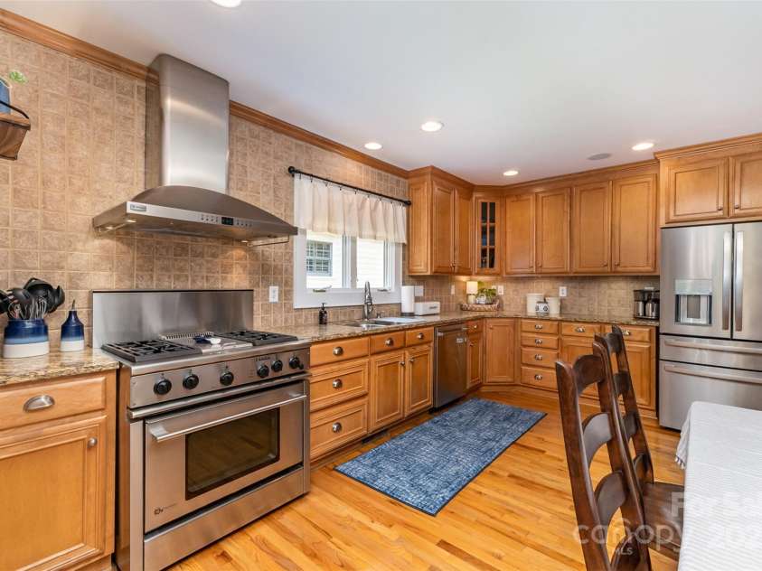 141 Eastover Drive, Concord, NC 28025.  MLS# CAR4264059, YatesRealty ID 17985. Kitchen features Bosch dishwasher, GE Profile Gas Range.