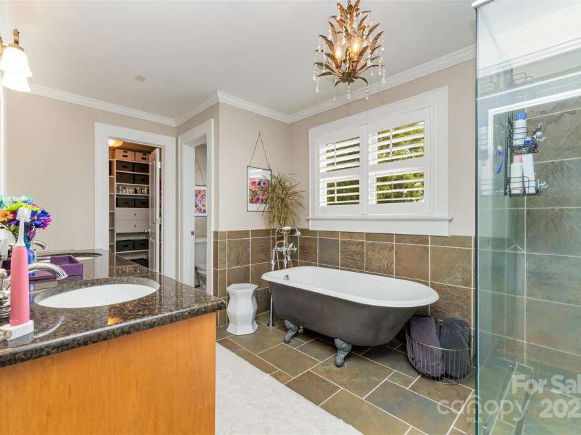 141 Eastover Drive, Concord, NC 28025.  MLS# CAR4264059, YatesRealty ID 17985. Primary Bathroom features clawfoot tub, glass/tile shower and access to custom closet.