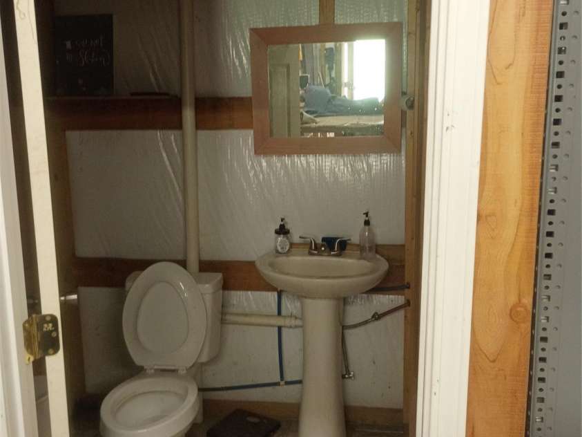 5427 Christopher Road, Iron Station, NC 28080.  MLS# CAR4367845, YatesRealty ID 17988. Garage Bath room
