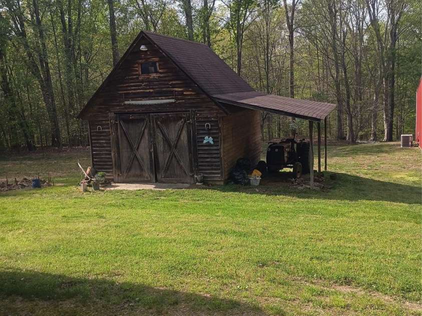 5427 Christopher Road, Iron Station, NC 28080.  MLS# CAR4367845, YatesRealty ID 17988. Storage Building with Tractor shed