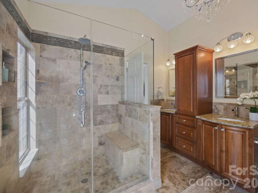 17115 Graves Court, Cornelius, NC 28031.  MLS# CAR4343687, YatesRealty ID 17990. Primary bathroom with a spa-like shower