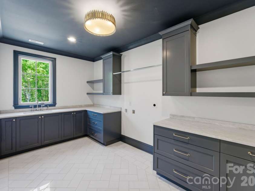 3035 Maple Way Drive, Davidson, NC 28036.  MLS# CAR4368514, YatesRealty ID 17993. Laundry Room Upper Level