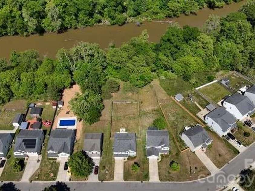 1212 Catawba Run, Lowell, NC 28098.  MLS# CAR4376003, YatesRealty ID 17996. Aerial view Catawba Run Rd with South Fork Catawba River in background