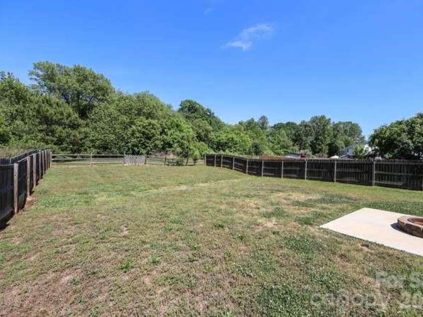 1212 Catawba Run, Lowell, NC 28098.  MLS# CAR4376003, YatesRealty ID 17996. Back yard