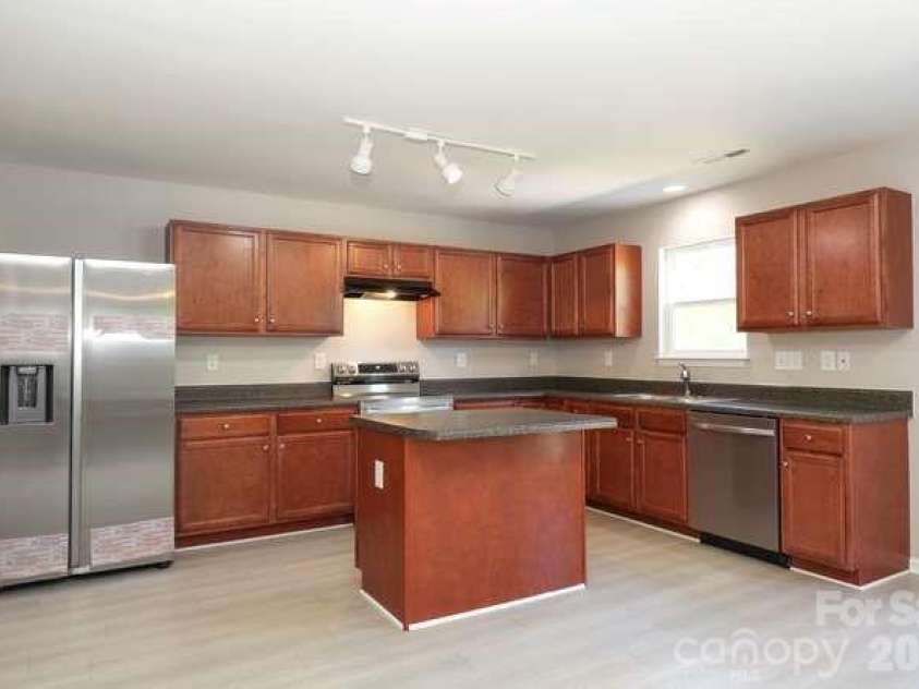 1212 Catawba Run, Lowell, NC 28098.  MLS# CAR4376003, YatesRealty ID 17996. Beautiful Kitchen, complete with new refrigerator, new electric range w/ smooth top, new dishwasher and new disposal