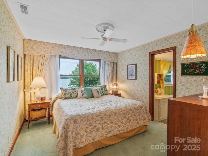 6345 Shore Drive, Nebo, NC 28761.  MLS# CAR4261495, YatesRealty ID 17999. Ensuite Bedroom on Main