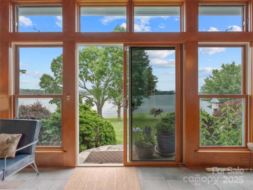 6345 Shore Drive, Nebo, NC 28761.  MLS# CAR4261495, YatesRealty ID 17999. Sliders to Lawn/Lake