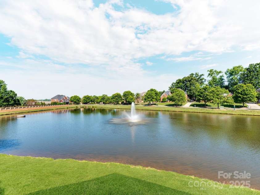 537 Montgrove Place, Concord, NC 28027.  MLS# CAR4266019, YatesRealty ID 18003. Community Fishing pond - view from clubhouse