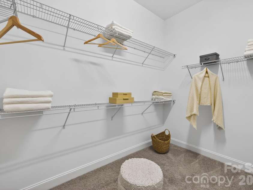 18018 Grey Mossrun Drive, Charlotte, NC 28278.  MLS# CAR4366883, YatesRealty ID 18005. Expansive primary closet space accommodates your wardrobe