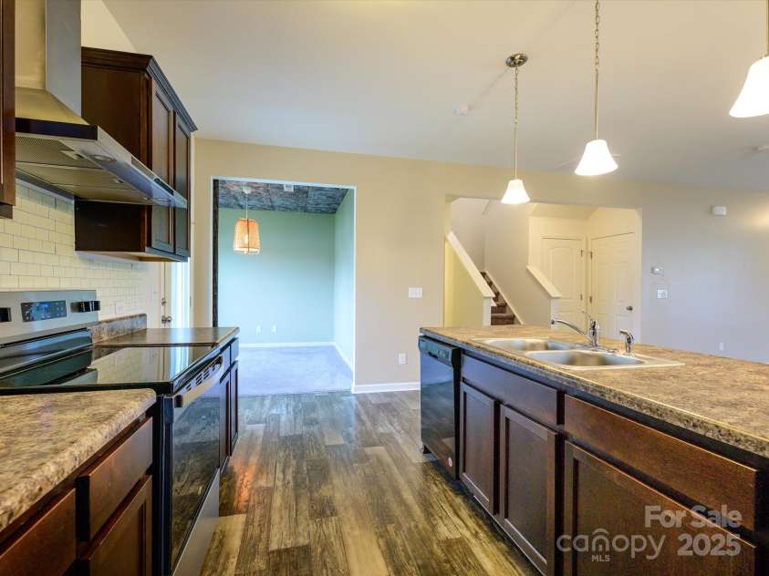 13022 Hill Pine Road, Midland, NC 28107.  MLS# CAR4265000, YatesRealty ID 18016. Galley style kitchen with new oven