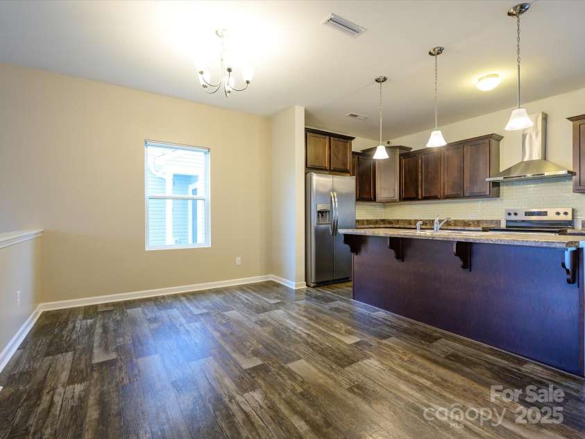 13022 Hill Pine Road, Midland, NC 28107.  MLS# CAR4265000, YatesRealty ID 18016. Large dining area can easily accommodate 8 people