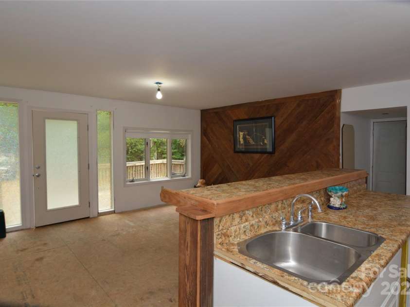 140 Ivy Trails Road, Weaverville, NC 28787.  MLS# CAR4228155, YatesRealty ID 18018. Living / Kitchen Area