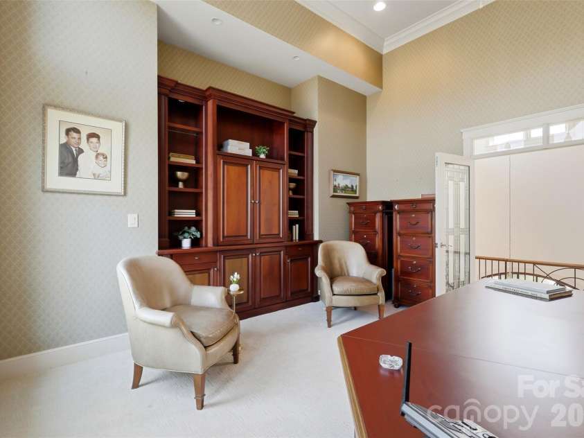 14606 Jockeys Ridge Drive, Charlotte, NC 28277.  MLS# CAR4356748, YatesRealty ID 18019. Built-ins, massive workstation, statement windows. Working from home just became a choice.