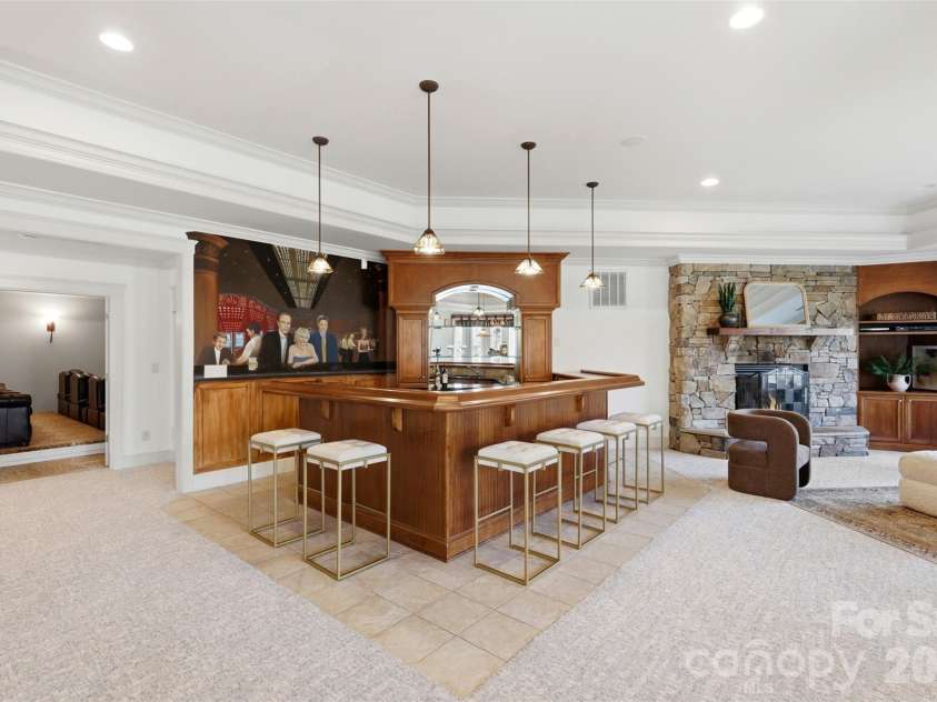 14606 Jockeys Ridge Drive, Charlotte, NC 28277.  MLS# CAR4356748, YatesRealty ID 18019. Custom bar with millwork and seating. Post-round drinks start here.