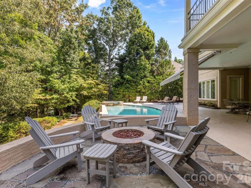14606 Jockeys Ridge Drive, Charlotte, NC 28277.  MLS# CAR4356748, YatesRealty ID 18019. New fire pit area. Tree canopy overhead. Summer evenings end here.