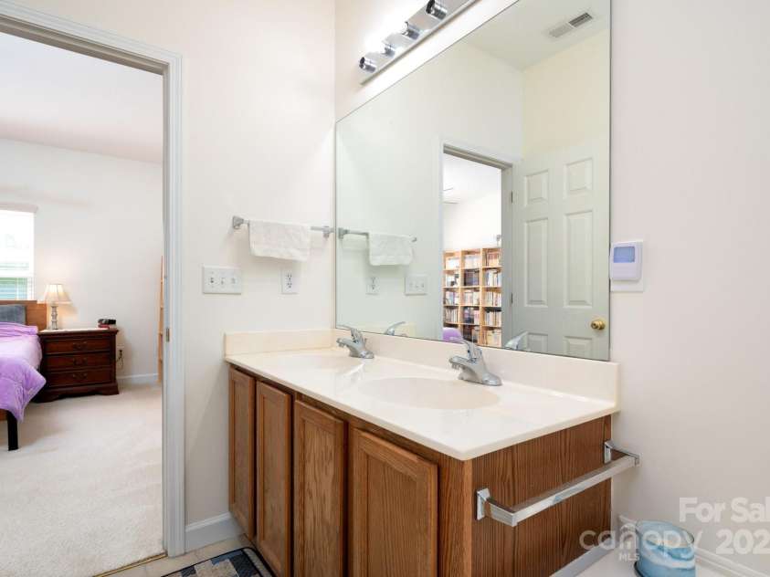 22 Scottish Circle, Asheville, NC 28803.  MLS# CAR4259005, YatesRealty ID 18021. Double Sink Vanity in the Primary Bathroom