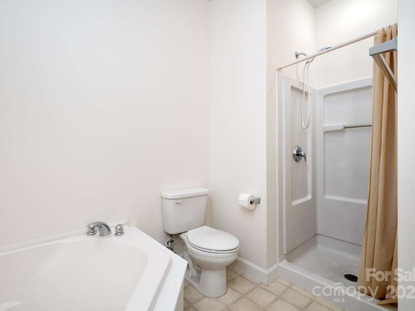 22 Scottish Circle, Asheville, NC 28803.  MLS# CAR4259005, YatesRealty ID 18021. Walk-in Shower and a Deep Soaking Tub