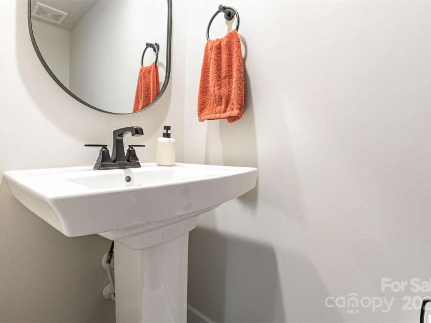 2203 Autumn Olive Lane, Stallings, NC 28104.  MLS# CAR4266791, YatesRealty ID 18025. Main level powder room