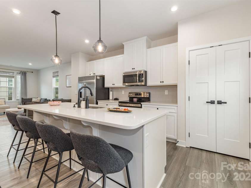 2203 Autumn Olive Lane, Stallings, NC 28104.  MLS# CAR4266791, YatesRealty ID 18025. Open concept kitchen & living room