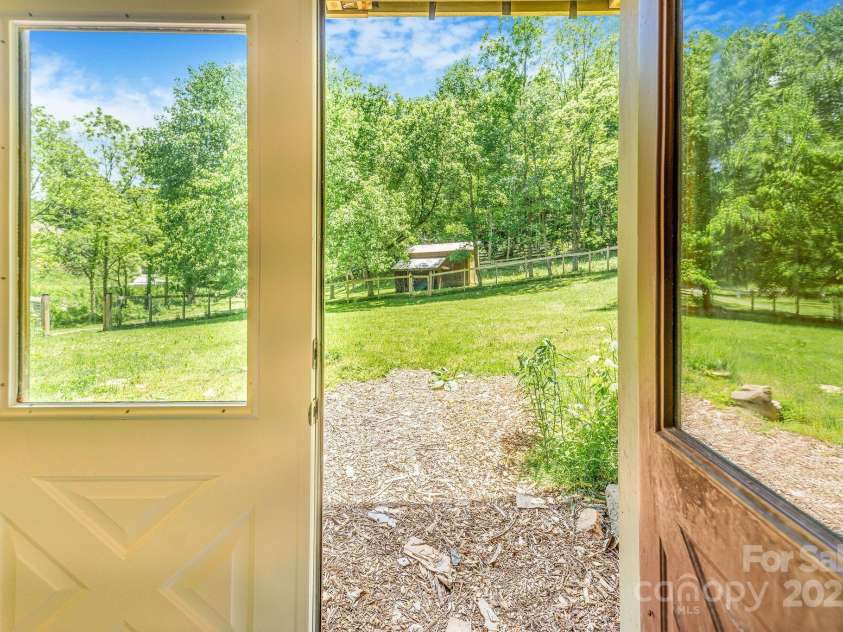 276 Morgan Branch Road, Marshall, NC 28753.  MLS# CAR4264012, YatesRealty ID 18026. Double door from bonus room into horse paddock.