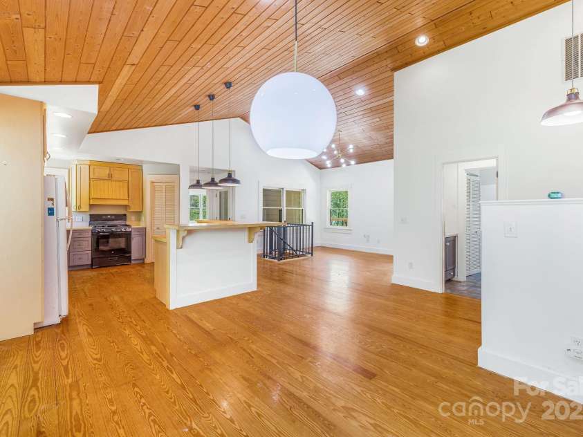 276 Morgan Branch Road, Marshall, NC 28753.  MLS# CAR4264012, YatesRealty ID 18026. Looking from dining room to kitchen and living room.