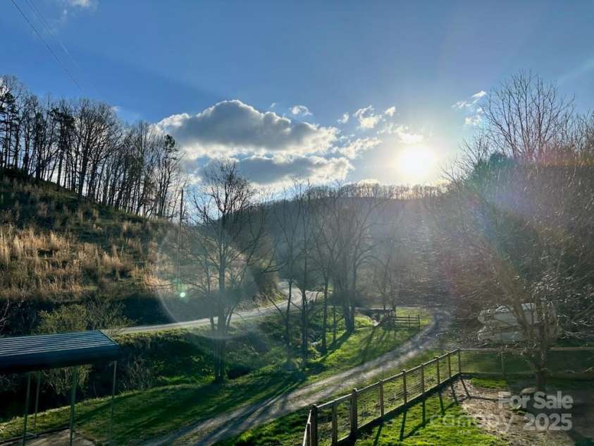 276 Morgan Branch Road, Marshall, NC 28753.  MLS# CAR4264012, YatesRealty ID 18026. Looking up the road from house.