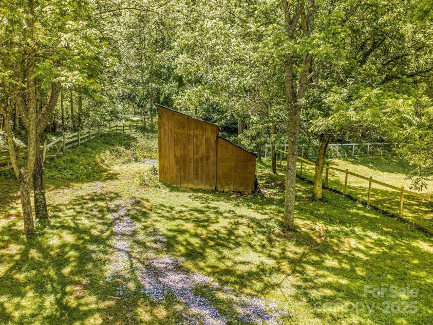 276 Morgan Branch Road, Marshall, NC 28753.  MLS# CAR4264012, YatesRealty ID 18026. Small barn on the far end of the horse paddock